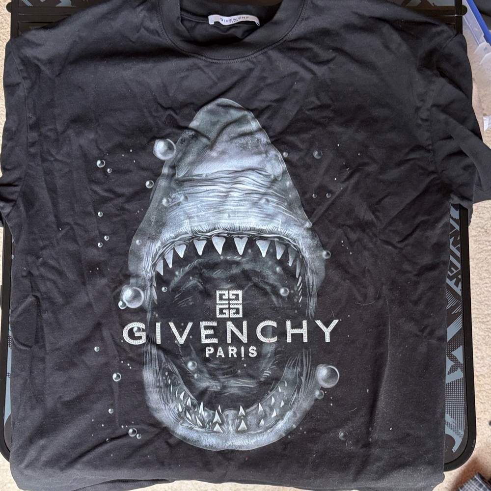 Black shirt with shark.
